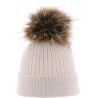 bonnet uni avec revers et pompon fausse fourure